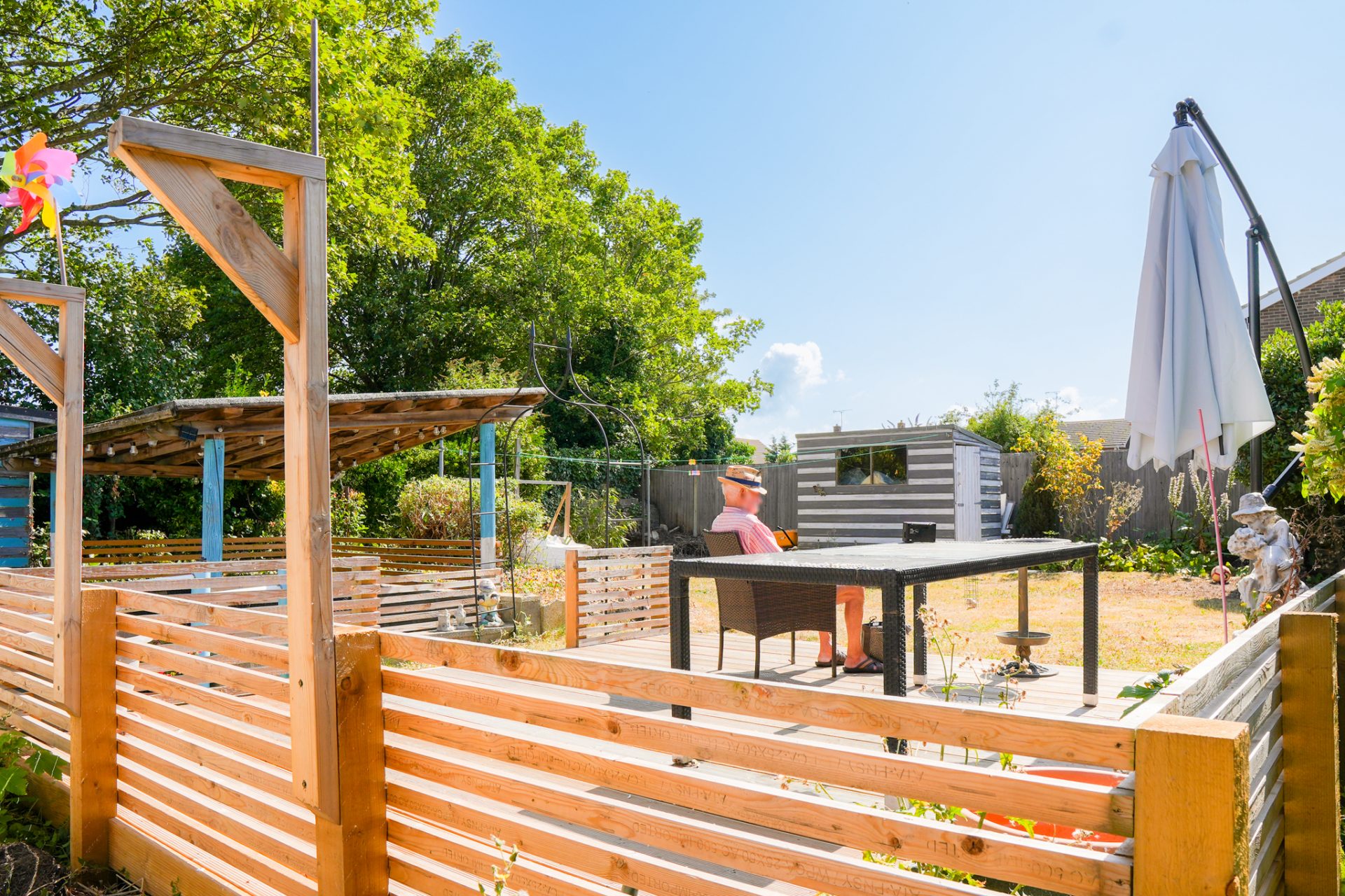 Outdoor patio with seating and fencing